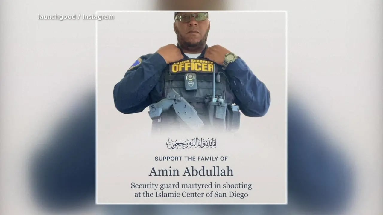 Mourners gather at a candlelight vigil to honor security guard Amin Abdullah and the victims of the Islamic Center of San Diego shooting