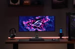 ASUS ultrawide OLED gaming monitor with secondary touchscreen display in futuristic gaming setup