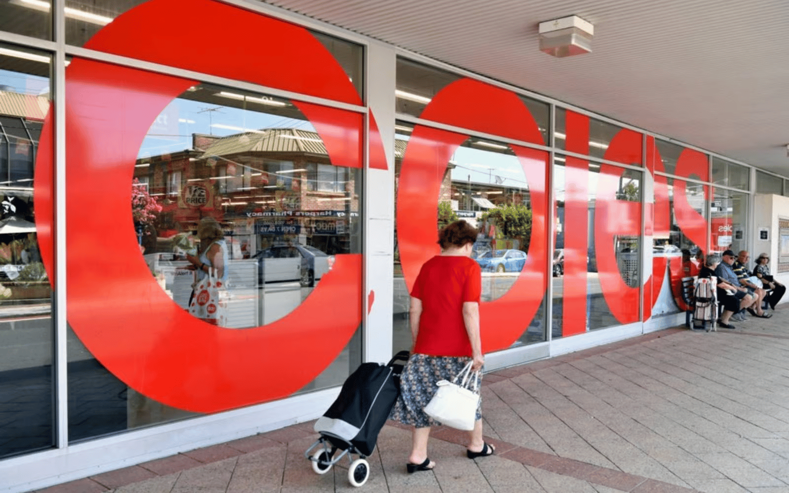 Shoppers walk through a Coles supermarket amid Australia fake discount pricing controversy