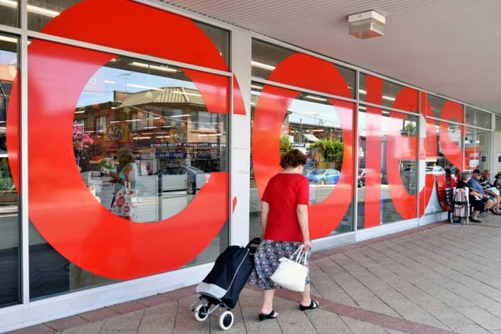 Shoppers walk through a Coles supermarket amid Australia fake discount pricing controversy