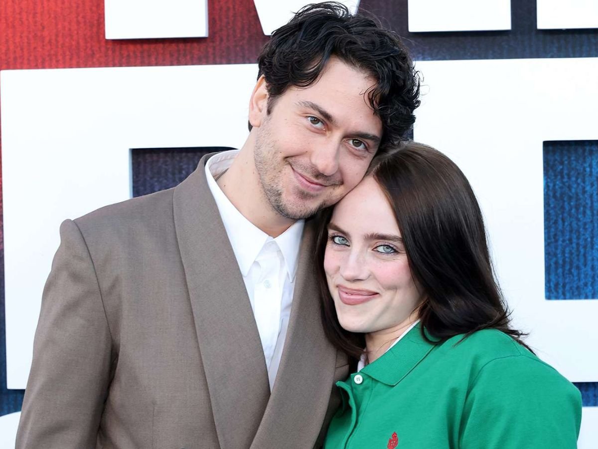 Billie Eilish and Nat Wolff walking together at Hollywood premiere red carpet event 2026