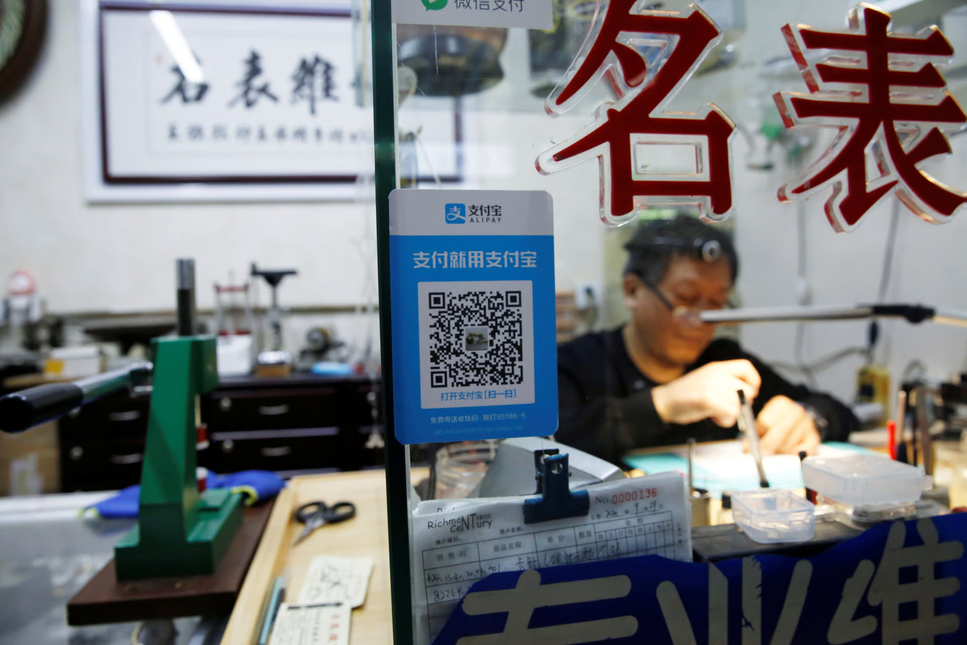 Chinese tourists using QR code mobile payments at Southeast Asia street market