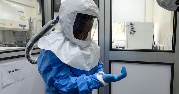 Laboratory technologist in protective equipment at Uganda Virus Research Institute in Entebbe Uganda during Ebola outbreak 2026