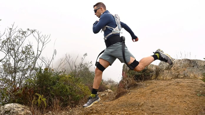 Hiker using the Hypershell X Ultra AI-powered exoskeleton on a mountain trail