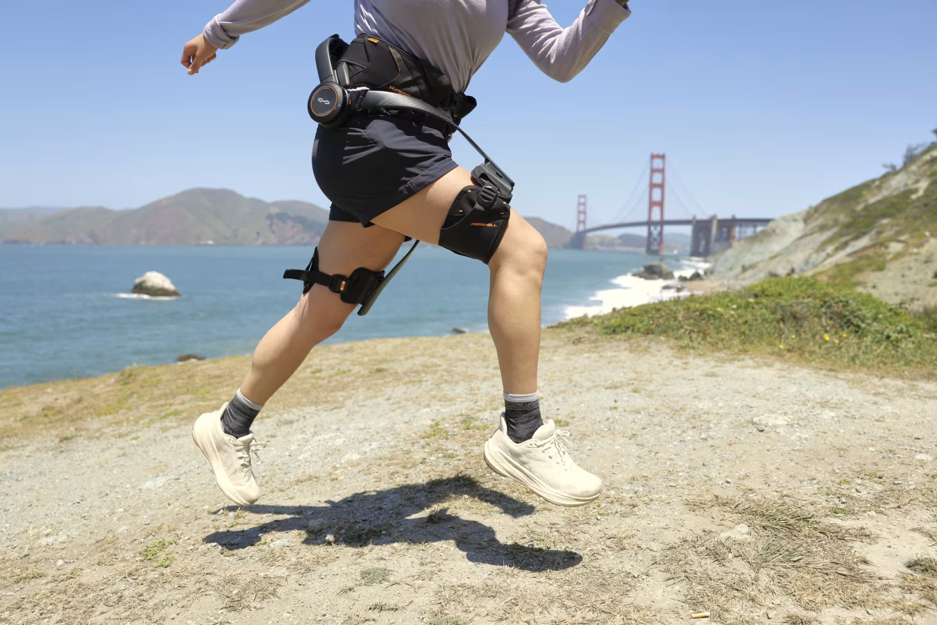 Tester hiking uphill while wearing the Hypershell X Ultra exoskeleton