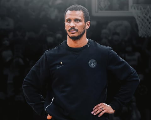 Joe Mazzulla poses after winning the NBA Coach of the Year award for the Boston Celtics in 2026