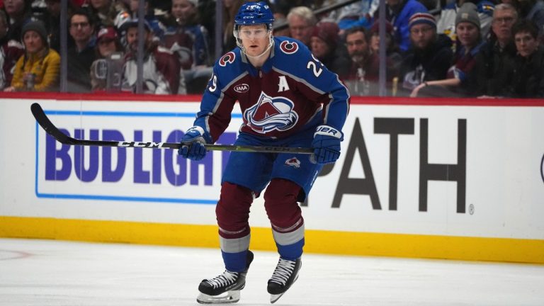 Nathan MacKinnon skating with the puck during the NHL playoffs