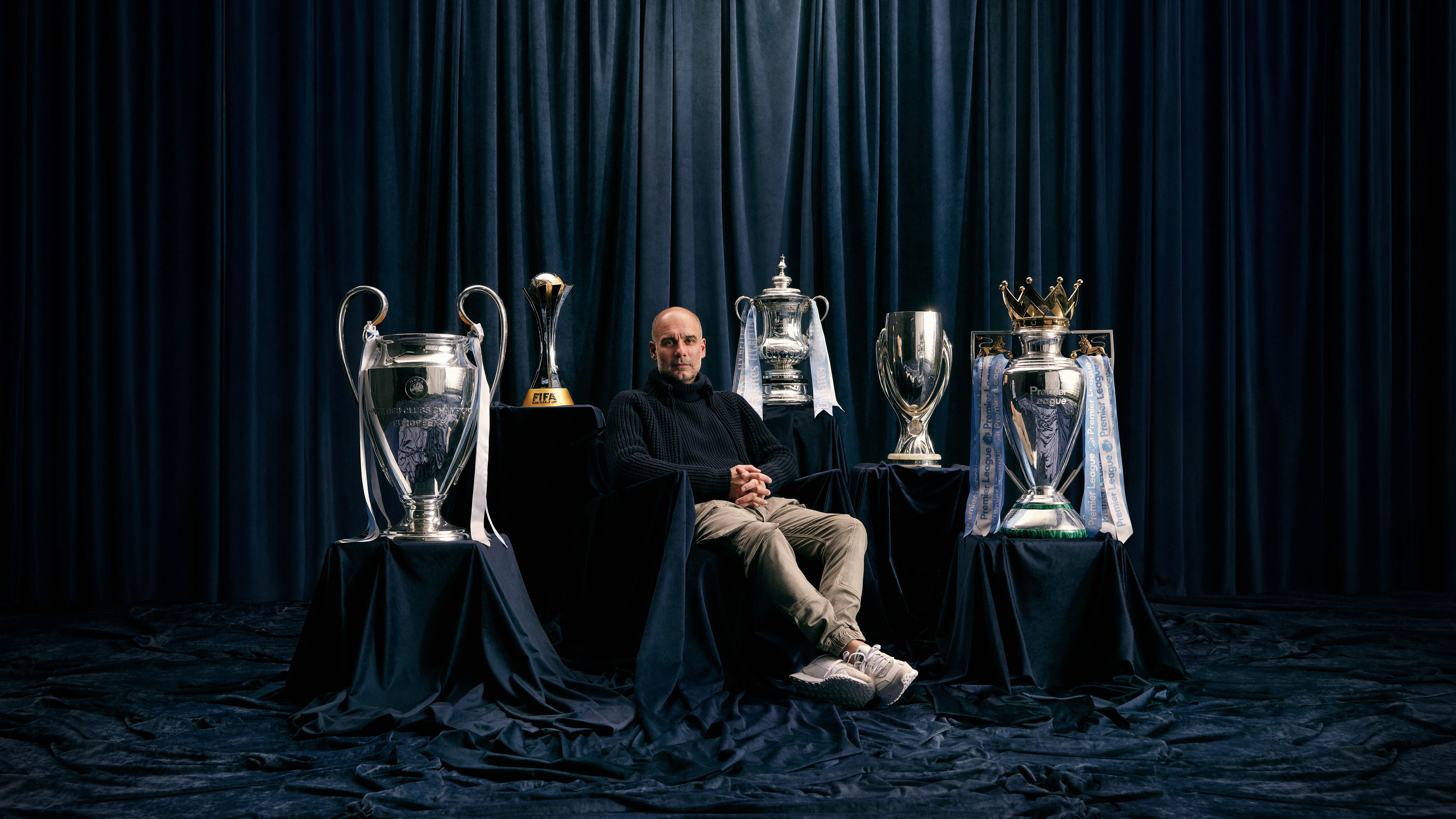 Pep Guardiola celebrates a title with Manchester City players