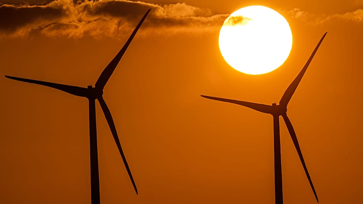 Wind turbines at sunset as renewables reach more than 70 percent of global power-sector investment in the IEA World Energy Investment 2026 report