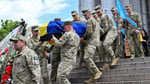 Russian and Ukrainian officials during a humanitarian exchange of fallen soldiers amid the ongoing Ukraine conflict