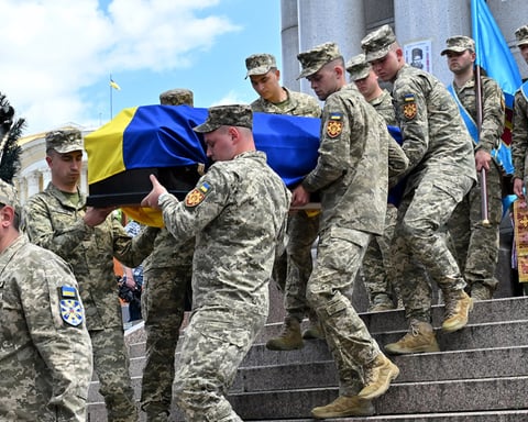 Russian and Ukrainian officials during a humanitarian exchange of fallen soldiers amid the ongoing Ukraine conflict