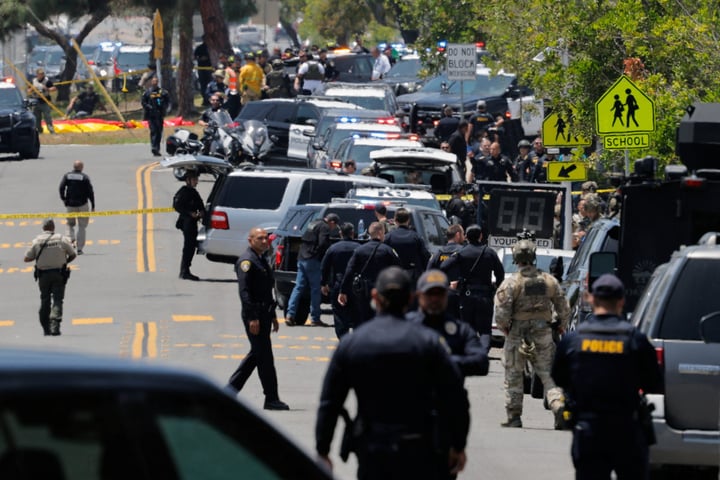 Police and emergency crews secure the Islamic Center of San Diego after two terrorists invoking a Christian crusade killed three in Clairemont
