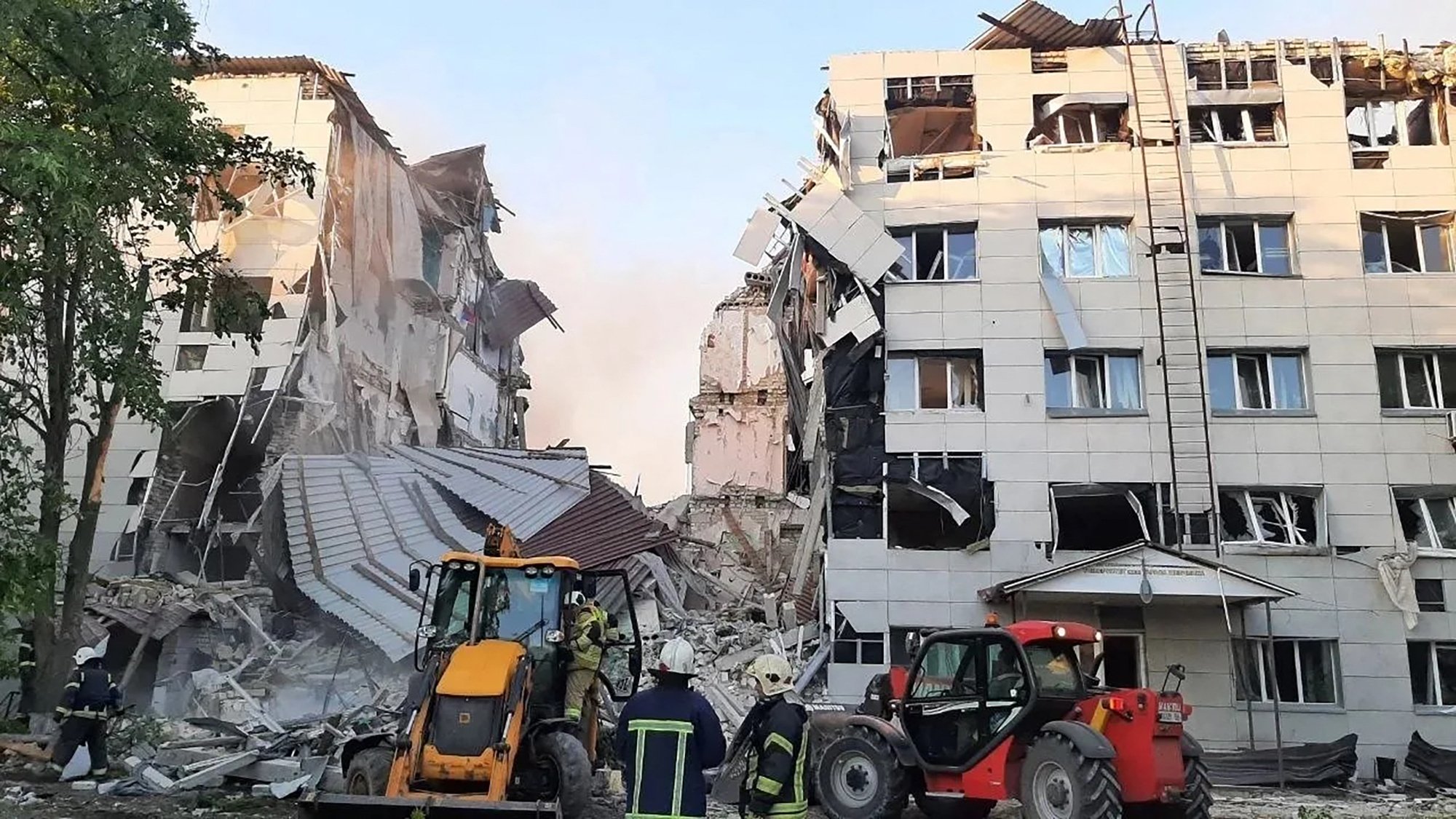 Rescue workers at the Starobelsk Professional College dormitory after the Ukrainian drone strike, May 22, 2026