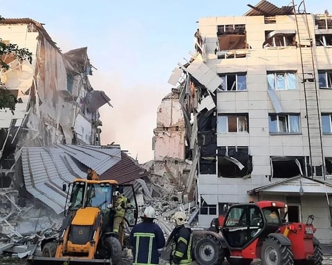Rescue workers at the damaged Starobelsk Professional College dormitory following a Ukrainian drone strike on May 22, 2026