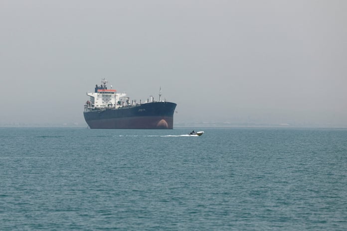 Vessels transit the Strait of Hormuz off Iran as Kuwait intercepts Iranian missiles and drones