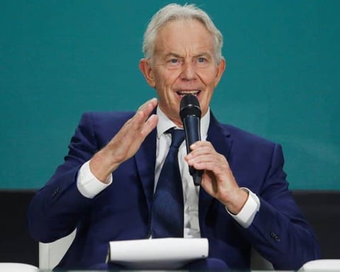 Former British prime minister Tony Blair speaking at a public event, calling for Labour to drop net zero