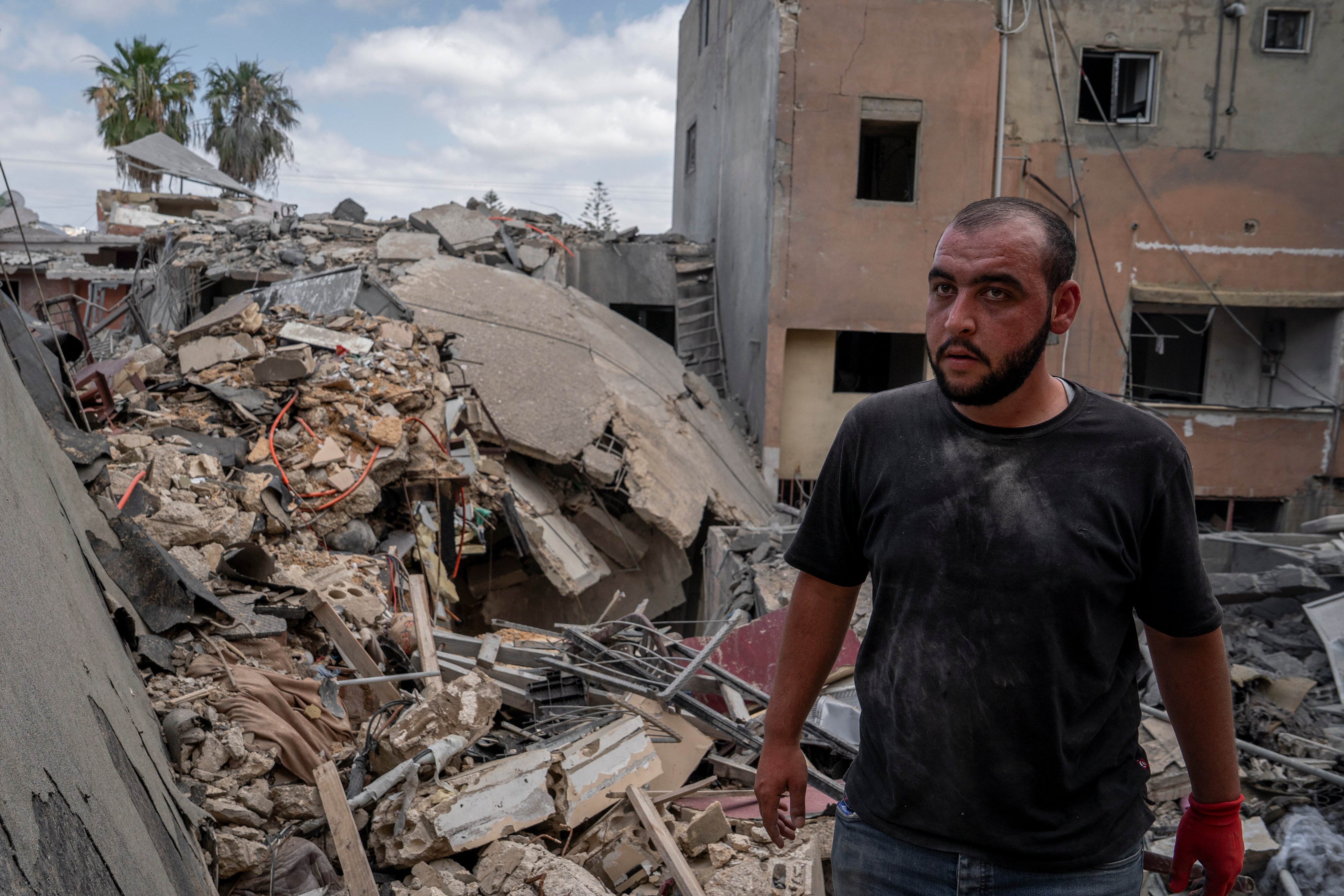 A man walks through the rubble caused by an Israeli air attack in Tyre, Lebanon, May 26, 2026