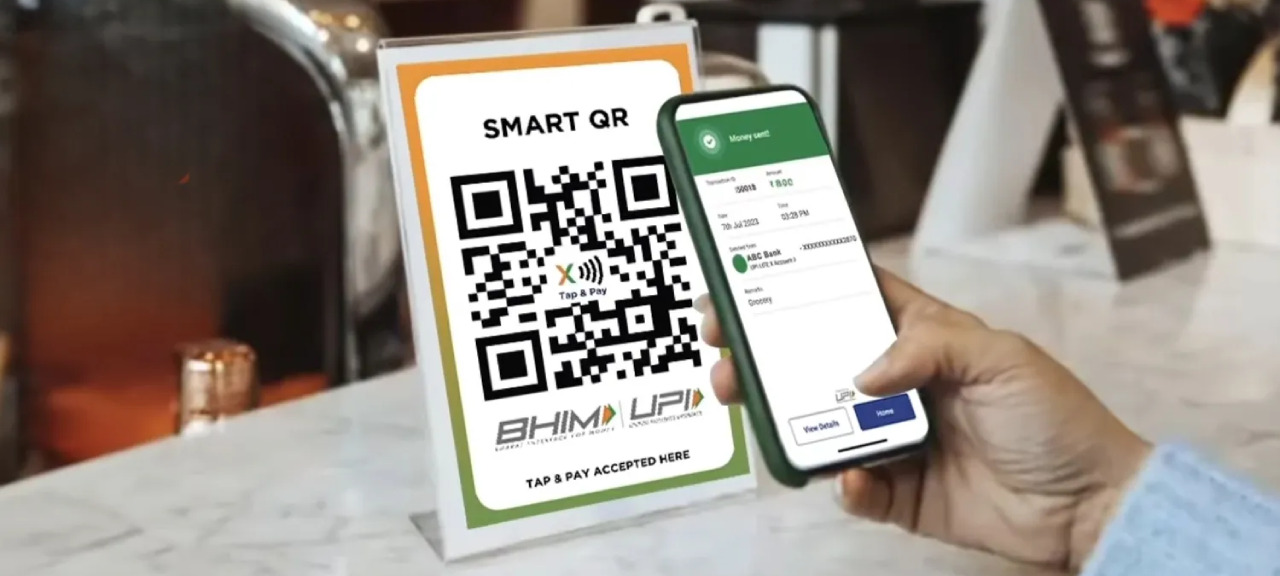 UPI Payments Continue To Expand Across India Customer making payment using UPI QR code at Indian retail store