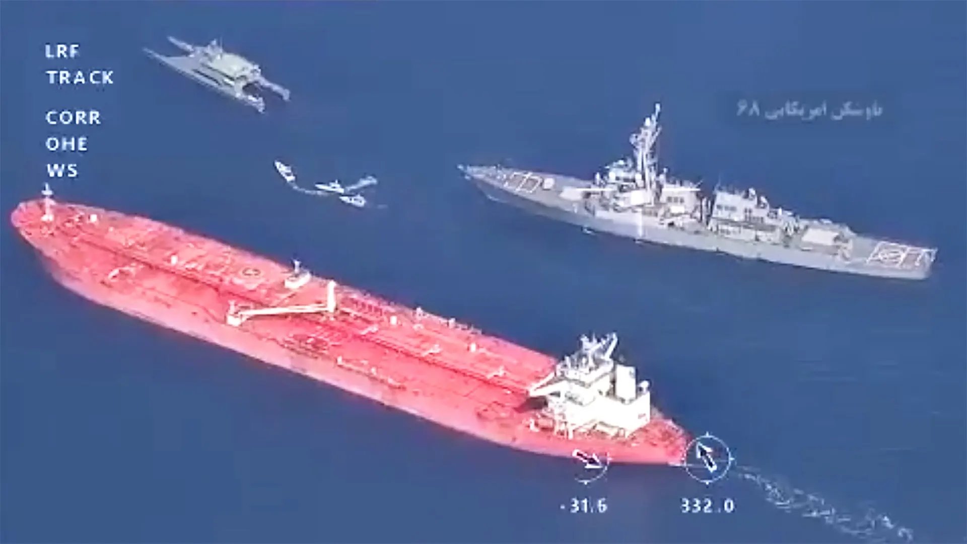 US Navy warships near Iranian oil tankers during the 2026 Strait of Hormuz crisis