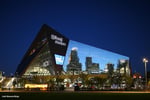 U.S. Bank Stadium with visual overlay representing Minnesota Vikings spending decline and ownership speculation