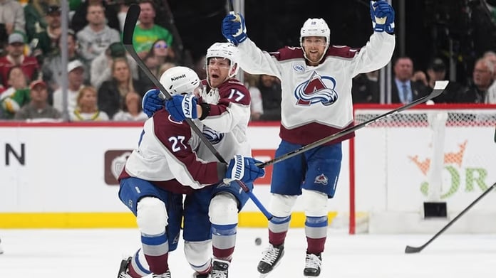 Minnesota Wild players celebrating early goal against Colorado Avalanche in playoff Game 3