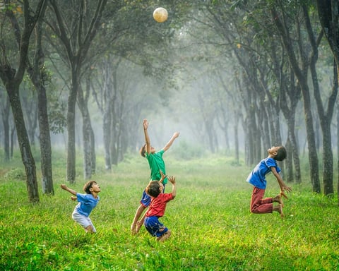 Children enjoying a 1990s summer outdoors with bikes and retro lifestyle activities