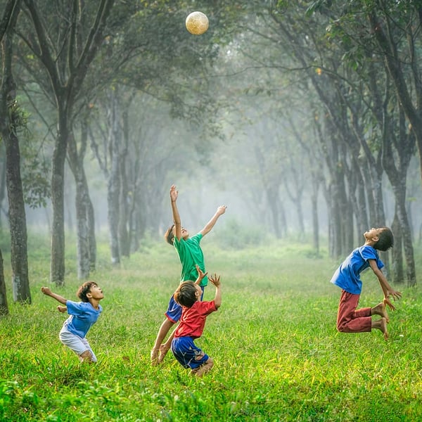 Children enjoying a 1990s summer outdoors with bikes and retro lifestyle activities