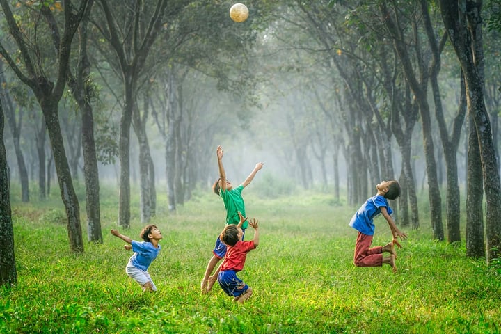 Children enjoying a 1990s summer outdoors with bikes and retro lifestyle activities