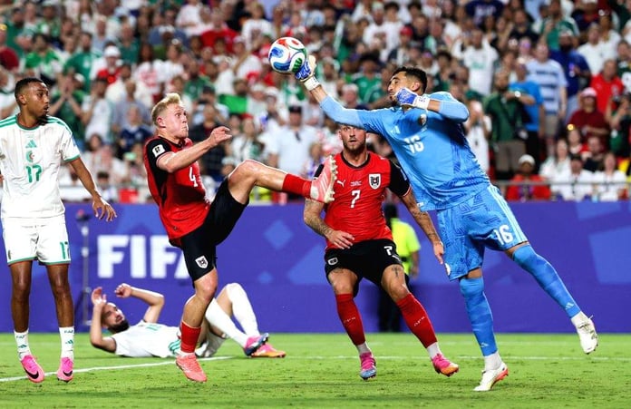 Riyad Mahrez celebrates after scoring Algeria's third goal against Austria in the 2026 FIFA World Cup Group J match at Arrowhead Stadium Kansas City