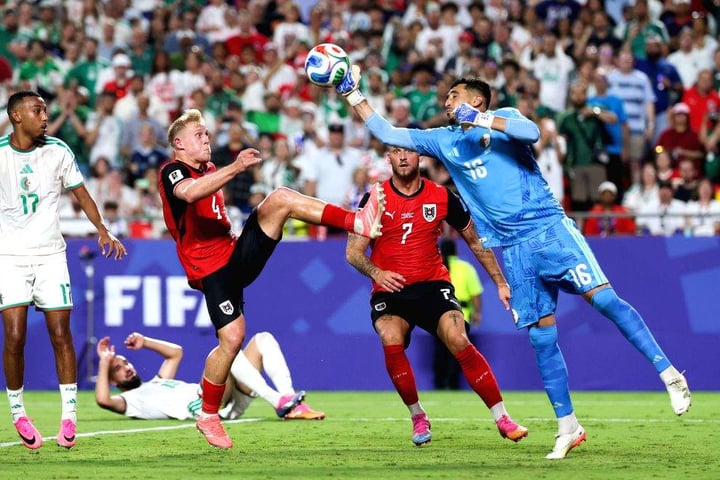 Riyad Mahrez celebrates after scoring Algeria's third goal against Austria in the 2026 FIFA World Cup Group J match at Arrowhead Stadium Kansas City