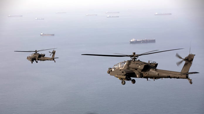 US Army AH-64 Apache attack helicopters patrolling Strait of Hormuz during Operation Epic Fury