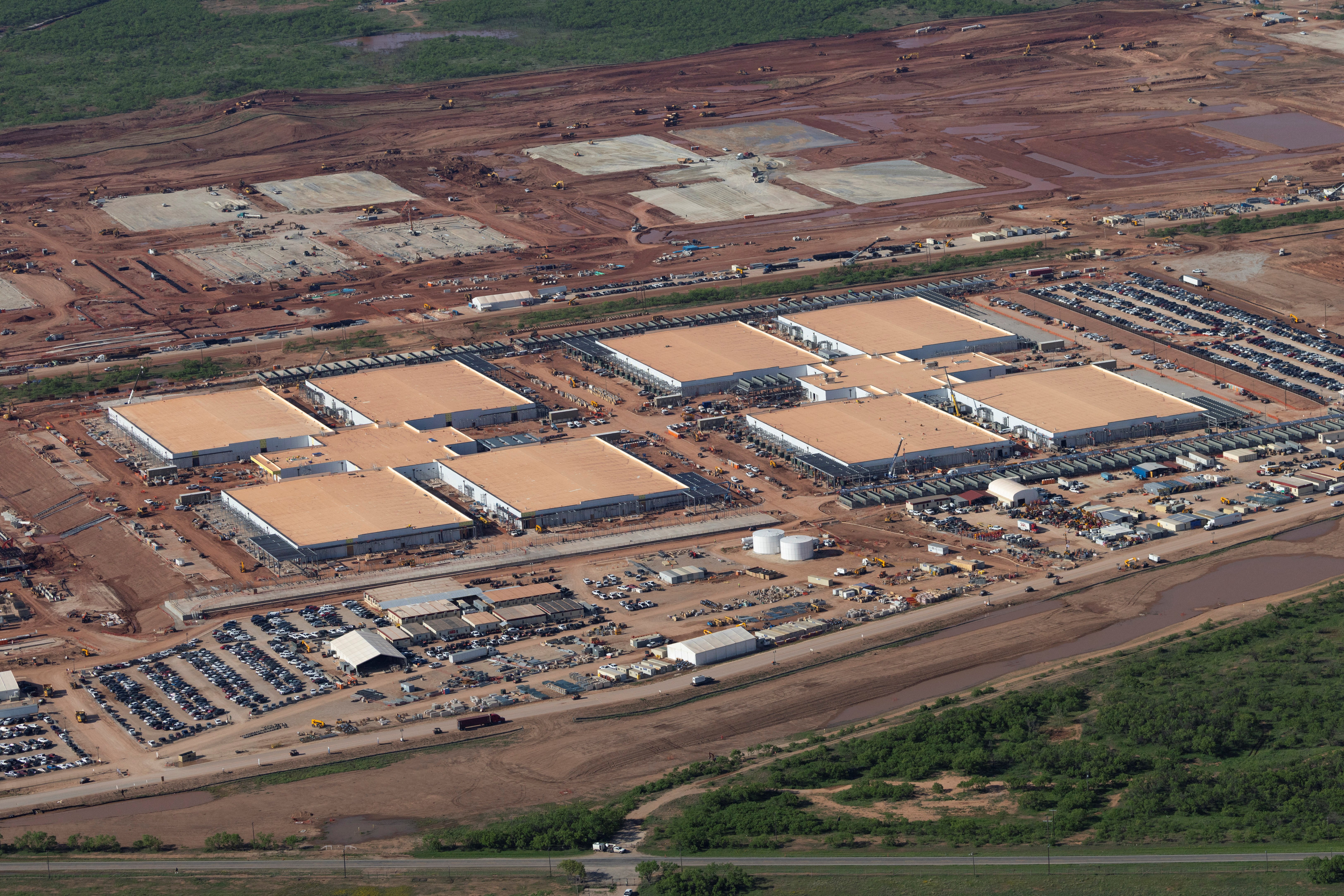 Aerial view of construction under way on a large AI data center infrastructure site