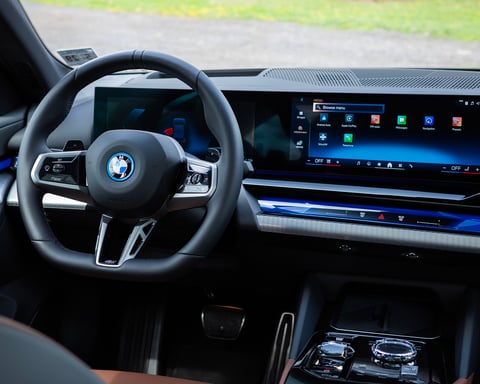 BMW 550e on the road representing automotive industry facing AI-driven memory chip shortage