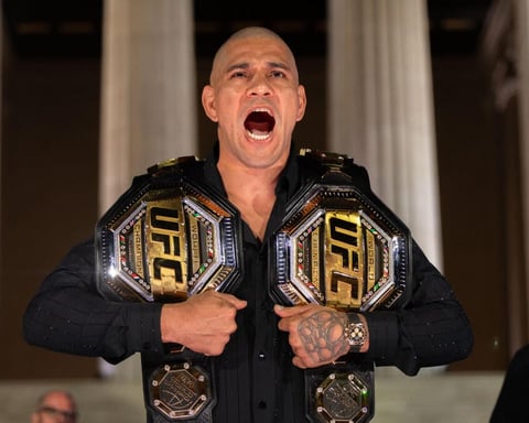 Alex Pereira poses with UFC championship belts ahead of his heavyweight debut at UFC Freedom 250 at the White House