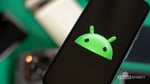 Android robot on a Pixel phone representing Canary 2606 Screen Reactions and Dynamic Color features