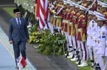 Malaysian Prime Minister Anwar Ibrahim inspects an honour guard during an official visit