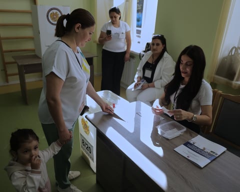 Armenian voters cast ballots at a polling station during the June 7 2026 parliamentary elections in Yerevan