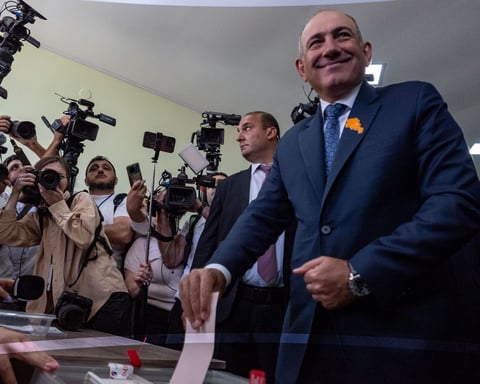 Election officials counting ballots at a polling station in Yerevan after Armenia's June 2026 parliamentary elections
