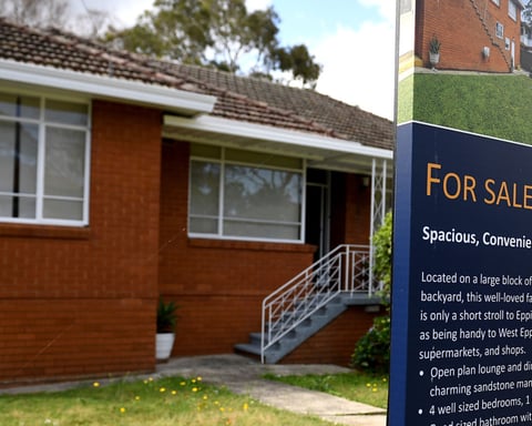 A house for sale sign outside a brick home, illustrating Australia's capital gains tax and negative gearing debate