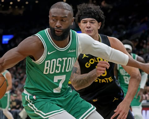 Jaylen Brown drives to the basket during an NBA game for the Boston Celtics