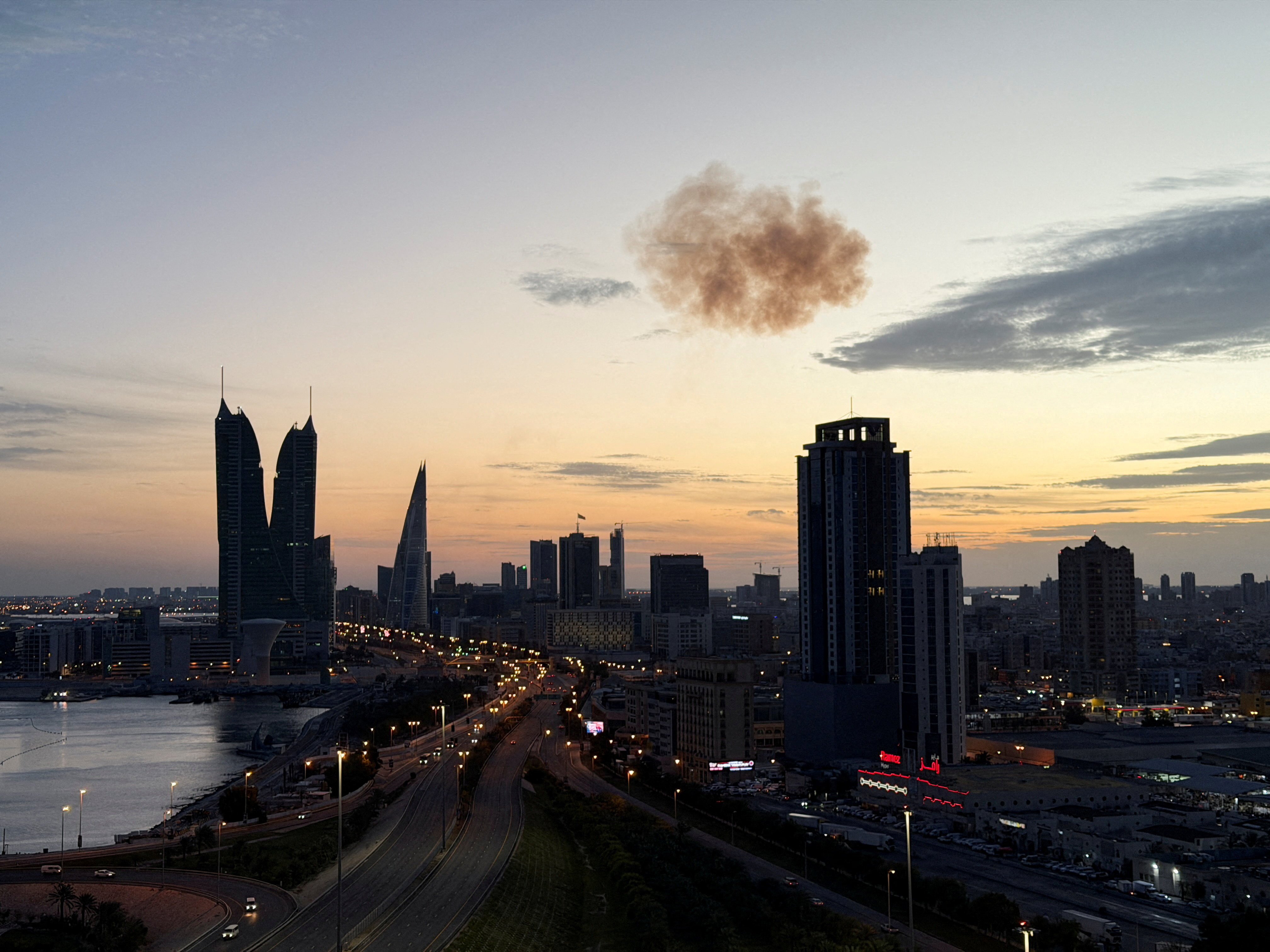 Smoke rises over Bahrain Financial Harbour Towers after Iranian drone interception, Manama, March 2026