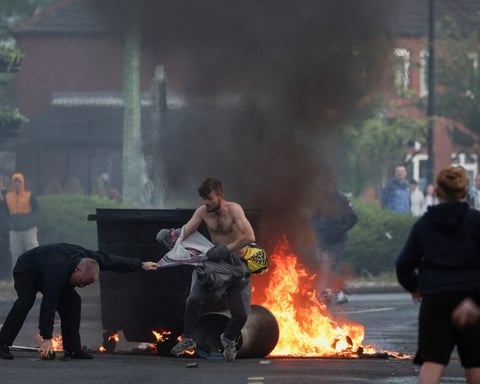 Vehicles set on fire by protesters burning on Newtownards Road east Belfast June 2026