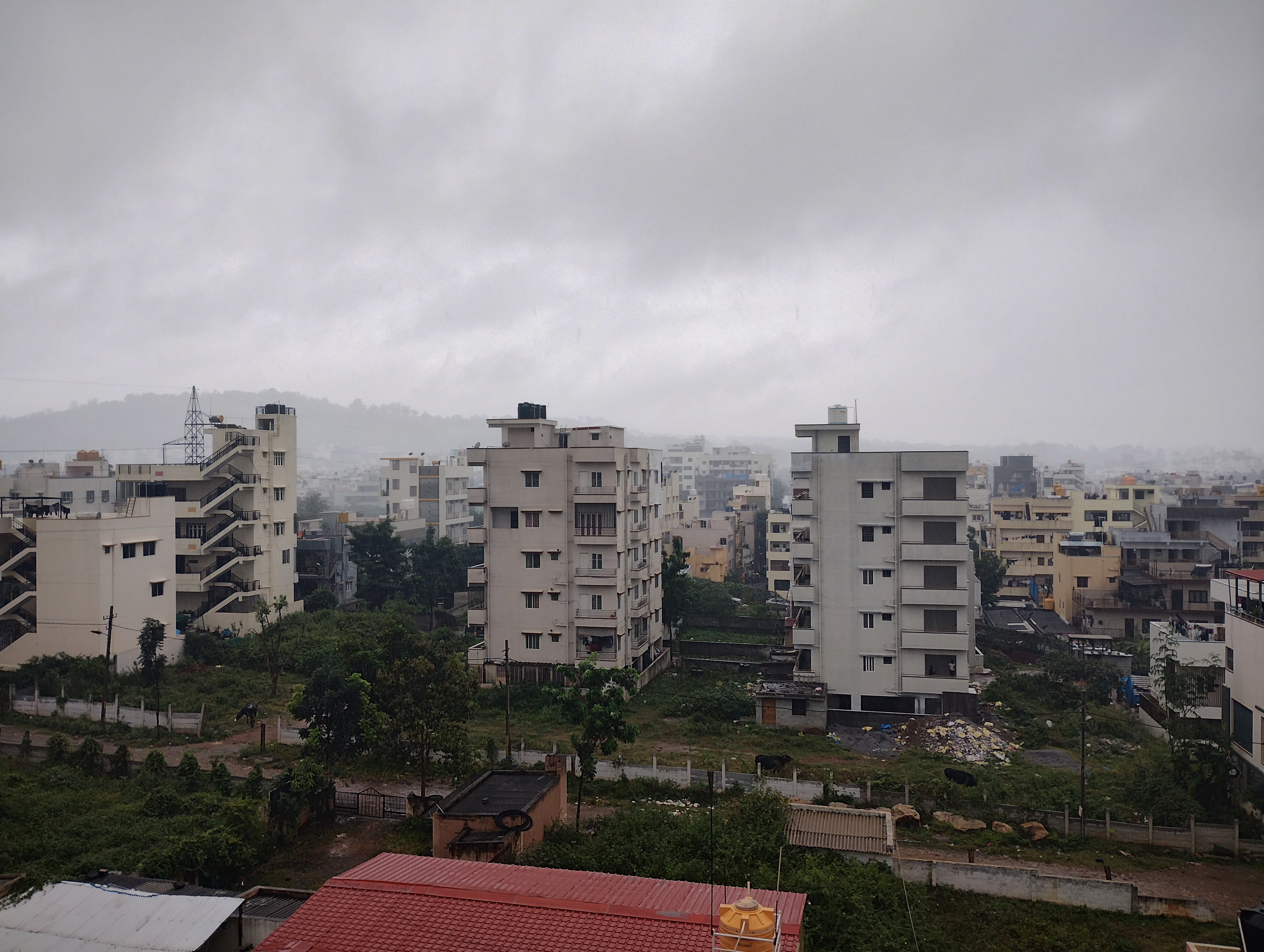 Heavy rain falling over a residential street in RR Nagar, Bengaluru