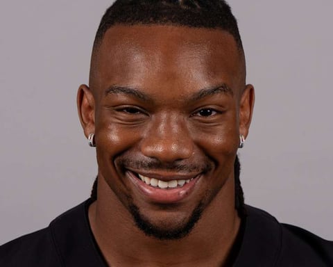 Bijan Robinson Atlanta Falcons running back poses for headshot at training facility 2025