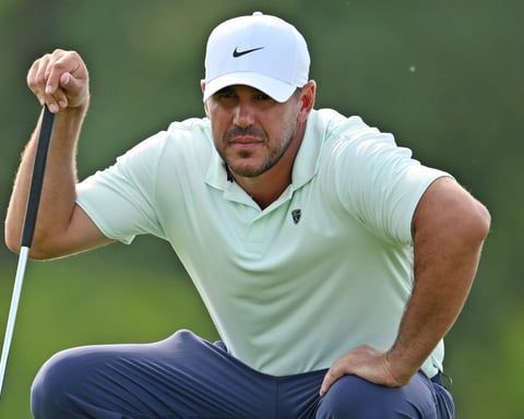 Brooks Koepka lines up a putt during the first round of the RBC Canadian Open 2026 at TPC Toronto at Osprey Valley