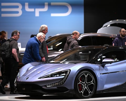 Chinese carmaker BYD displays an electric vehicle model at the Essen Motor Show in Germany