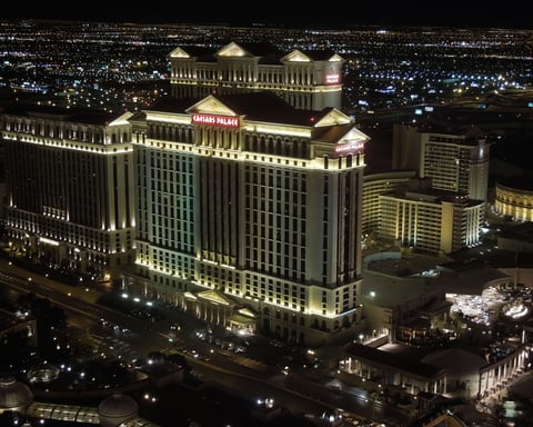 Caesars Palace hotel exterior illuminated at night in Las Vegas, Nevada
