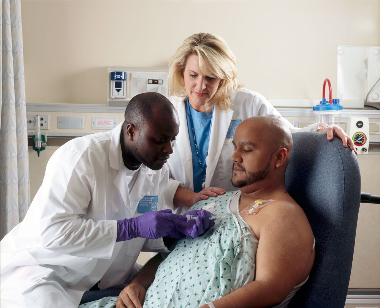 A cancer patient receiving chemotherapy infusion, the standard of care treatment that ASCO warns against substituting with unproven antiparasitic drugs