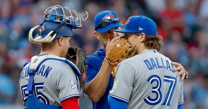 Toronto Blue Jays pitcher Chad Dallas with pitching coach Pete Walker and catcher Tyler Heineman during his MLB debut against the Atlanta Braves, June 4, 2026