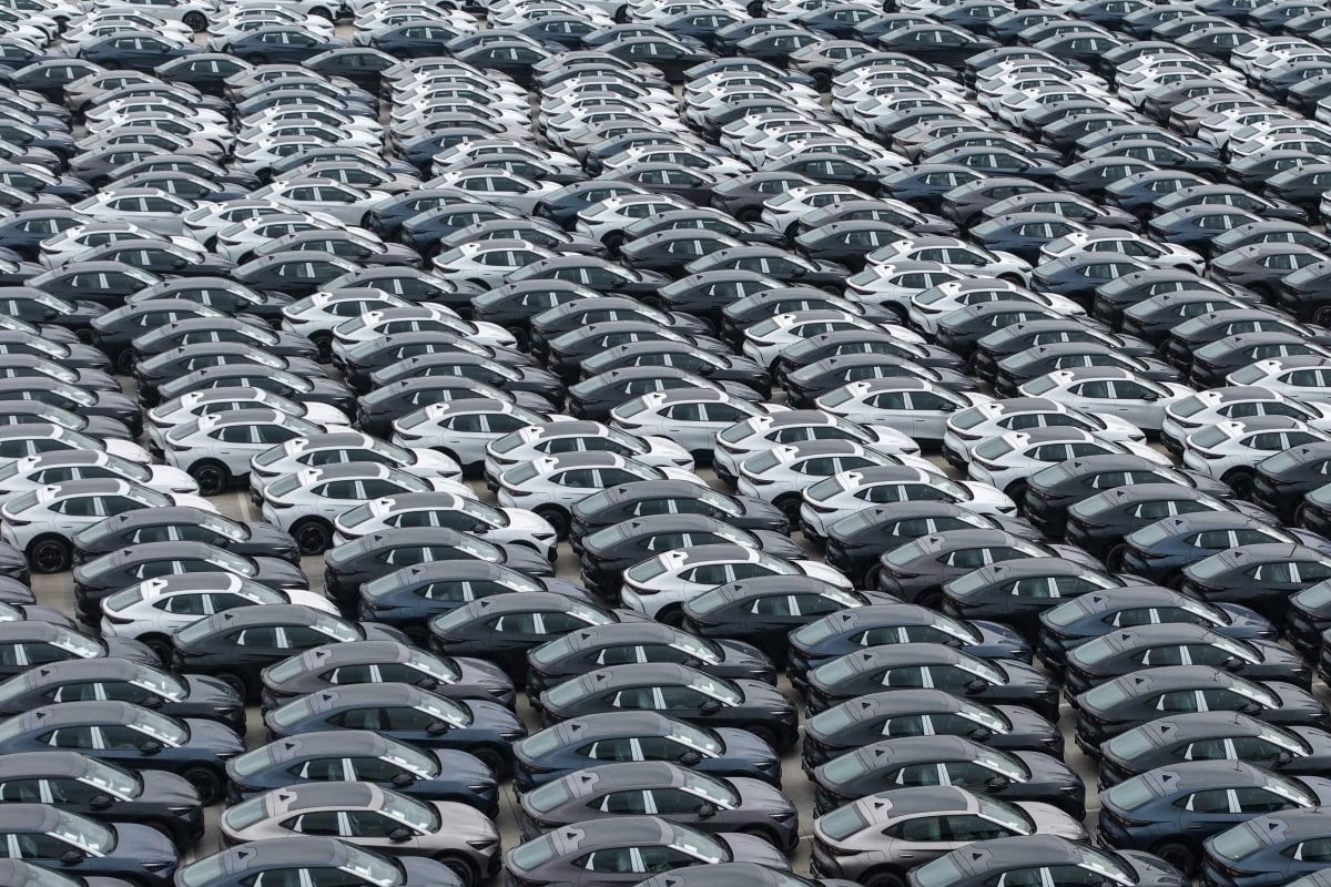 Chinese-made electric vehicles parked at an export port awaiting shipment